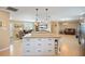 White kitchen island with ample storage and granite top at 3887 50Th S Ave, St Petersburg, FL 33711