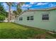 Light green house exterior with well-maintained lawn at 3887 50Th S Ave, St Petersburg, FL 33711