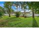 Large backyard with lush grass and tropical landscaping at 3887 50Th S Ave, St Petersburg, FL 33711