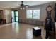 Living room with tiled floors and large windows at 3887 50Th S Ave, St Petersburg, FL 33711