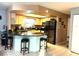 L-shaped kitchen with granite countertops and stainless steel appliances at 8019 Cedar Run Dr, Port Richey, FL 34668