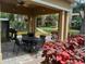Covered patio area with grill and seating for outdoor dining at 10108 Courtney Oaks Cir # 203, Tampa, FL 33619