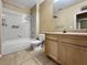 Bathroom with a tub, toilet, vanity, and tiled flooring at 10108 Courtney Oaks Cir # 203, Tampa, FL 33619