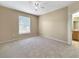 Bedroom featuring natural light from a window and a doorway leading to an adjacent bathroom at 10108 Courtney Oaks Cir # 203, Tampa, FL 33619
