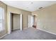 Carpeted bedroom with ample natural light, and closet with open doors at 10108 Courtney Oaks Cir # 203, Tampa, FL 33619
