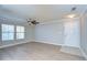 Living room with hardwood floors, ceiling fan, and windows at 18163 Bridle Club Dr # 18163, Tampa, FL 33647