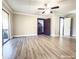 Living room with laminate flooring, neutral walls and access to balcony at 220 N Bayshore Blvd # 108, Clearwater, FL 33759