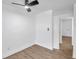 Bright bedroom with ceiling fan and wood-look tile floors at 2353 Shelley St # 16, Clearwater, FL 33765