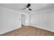 Well-lit bedroom with ceiling fan and access to another room at 2353 Shelley St # 16, Clearwater, FL 33765