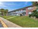 Brick apartment building with landscaping and walkway at 2353 Shelley St # 16, Clearwater, FL 33765