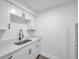 Modern white kitchen with stainless steel appliances and quartz countertops at 2353 Shelley St # 16, Clearwater, FL 33765