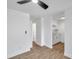 Living room, kitchen, and hallway with wood-look tile floors at 2353 Shelley St # 16, Clearwater, FL 33765