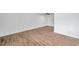 Bright living room with wood-look tile floors at 2353 Shelley St # 16, Clearwater, FL 33765