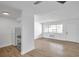 Living room with kitchen and wood-look floors at 2353 Shelley St # 16, Clearwater, FL 33765