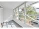 Bright sunroom with large windows and gray flooring at 2353 Shelley St # 16, Clearwater, FL 33765