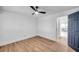 Well-lit bedroom featuring wood floors and access to another room at 2353 Shelley St # 4, Clearwater, FL 33765