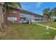 Front view of a two-story building with brick and neutral accents at 2353 Shelley St # 4, Clearwater, FL 33765