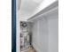 Small closet with water heater and shelving for storage at 2353 Shelley St # 4, Clearwater, FL 33765