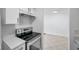 Modern electric stove in open concept kitchen at 2353 Shelley St # 4, Clearwater, FL 33765