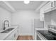 Modern kitchen featuring white shaker cabinets and stainless steel appliances at 2353 Shelley St # 4, Clearwater, FL 33765