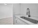Modern kitchen sink and faucet with white shaker cabinets at 2353 Shelley St # 4, Clearwater, FL 33765