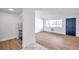 Bright living room with wood-look floors and access to the kitchen at 2353 Shelley St # 4, Clearwater, FL 33765