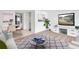 Living room with hardwood floors, a white entertainment center and a dining area at 2353 Shelley St # 4, Clearwater, FL 33765