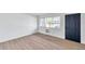 Bright living room with hardwood floors and a dark door at 2353 Shelley St # 4, Clearwater, FL 33765