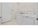 Laundry room with washer, dryer, and shelving at 5085 Ivory Stone Dr, Wimauma, FL 33598