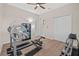 Well-equipped home gym featuring weights and a weight bench at 5085 Ivory Stone Dr, Wimauma, FL 33598