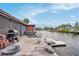 Outdoor patio area with grill and water access at 5092 Cedarbrook Ln, Hernando Beach, FL 34607