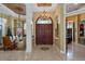 Grand entry with chandelier and high ceilings at 531 Isleworth Close, Tarpon Springs, FL 34688