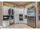 Kitchen with granite countertops, white cabinets and stainless steel appliances at 531 Isleworth Close, Tarpon Springs, FL 34688