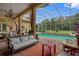 Relaxing poolside patio with comfortable seating and beautiful views at 531 Isleworth Close, Tarpon Springs, FL 34688
