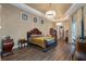 Bright main bedroom featuring a luxurious bed and walk-in closet at 531 Isleworth Close, Tarpon Springs, FL 34688