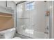 Clean bathroom with a tub shower combo and window at 531 Isleworth Close, Tarpon Springs, FL 34688