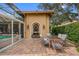 Stone patio with fountain and table for dining al fresco at 531 Isleworth Close, Tarpon Springs, FL 34688