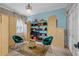 Large walk-in closet with custom shelving and seating at 531 Isleworth Close, Tarpon Springs, FL 34688