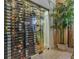 Impressive glass-enclosed wine cellar with ample storage at 531 Isleworth Close, Tarpon Springs, FL 34688
