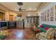 Spacious living room featuring a fireplace and hardwood floors at 531 Isleworth Close, Tarpon Springs, FL 34688