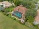 Home with pool and spa, situated by golf course at 531 Isleworth Close, Tarpon Springs, FL 34688