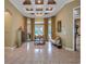 Bright Gathering room with high ceilings, hardwood floors, and a cozy fireplace at 531 Isleworth Close, Tarpon Springs, FL 34688