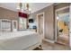 Spacious bedroom with a large bed, built-in workspace, and plenty of natural light at 531 Isleworth Close, Tarpon Springs, FL 34688