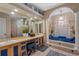 Spa-like bathroom with a large soaking tub, double vanity, and walk in shower at 531 Isleworth Close, Tarpon Springs, FL 34688