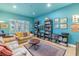 Relaxing living room featuring a large bookcase and hardwood floors at 838 Monterey Ne Blvd, St Petersburg, FL 33704