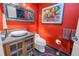 Stylish bathroom with red walls, mosaic tile, and modern vanity at 838 Monterey Ne Blvd, St Petersburg, FL 33704
