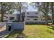 Modern home exterior with a landscaped yard and large trees at 838 Monterey Ne Blvd, St Petersburg, FL 33704