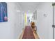 Long hallway with hardwood floors and neutral walls at 838 Monterey Ne Blvd, St Petersburg, FL 33704