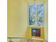 Stairwell with yellow walls, a modern chandelier, and a large window at 838 Monterey Ne Blvd, St Petersburg, FL 33704