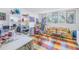 Colorful studio with a sofa, art supplies, and a cheerful atmosphere at 838 Monterey Ne Blvd, St Petersburg, FL 33704
